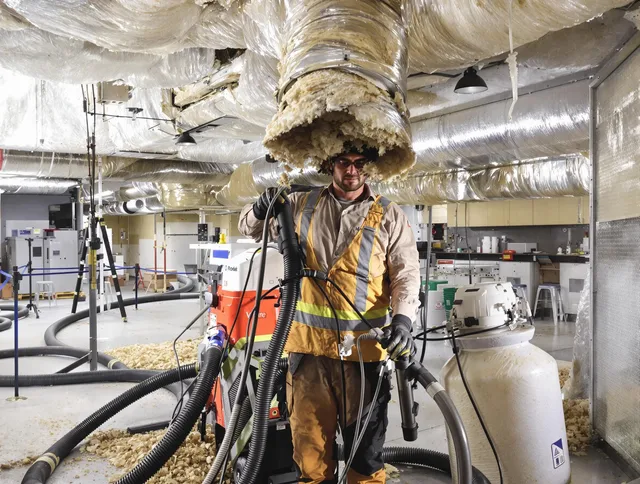 Professional vacuum insulation removal by Ashland Air Duct Cleaning expert in Ashland